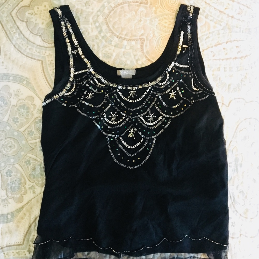 Black top with sequin detail!